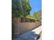 Long stucco fence topped with decorative ironwork and providing security and privacy to the property at 7201 Mission Hills Dr, Las Vegas, NV 89113
