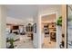 Inviting foyer leading to a spacious living room with fireplace and a modern kitchen at 7201 Mission Hills Dr, Las Vegas, NV 89113