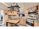 Bright kitchen featuring stainless steel appliances, light wood cabinetry, and granite countertops at 7201 Mission Hills Dr, Las Vegas, NV 89113