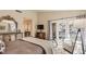 Serene bedroom with access to a private patio through French doors, featuring a cozy sitting area at 7201 Mission Hills Dr, Las Vegas, NV 89113