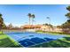 Well-maintained tennis court with blue and green playing surface and clear perimeter fencing at 7201 Mission Hills Dr, Las Vegas, NV 89113
