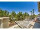 Balcony with relaxing hammock and stunning views of the surrounding trees at 776 Tillis Pl, Las Vegas, NV 89138