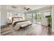 Bedroom boasts a ceiling fan and sliding glass door to a balcony at 776 Tillis Pl, Las Vegas, NV 89138