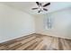 Bedroom featuring wood floors, plantation shutters and ceiling fan at 776 Tillis Pl, Las Vegas, NV 89138