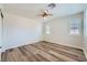 Bedroom featuring wood floors and plantation shutters at 776 Tillis Pl, Las Vegas, NV 89138