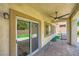 Relaxing covered patio with a ceiling fan, sliding glass doors, and a built-in grill, great for outdoor living at 776 Tillis Pl, Las Vegas, NV 89138