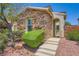 Charming single-story home featuring a stone facade and well-manicured landscaping at 776 Tillis Pl, Las Vegas, NV 89138