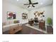 Comfortable home office with a large desk, sofa, and a map-themed wall decoration at 776 Tillis Pl, Las Vegas, NV 89138