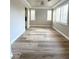 Open living space with large windows, hardwood floors and recessed lighting at 776 Tillis Pl, Las Vegas, NV 89138