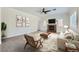 Bright living room with a ceiling fan, fireplace, and comfortable seating arrangement at 776 Tillis Pl, Las Vegas, NV 89138