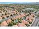 Expansive aerial shot showcasing a residential area with well-maintained homes and lush landscaping at 8416 Dry Cliff Cir, Las Vegas, NV 89128