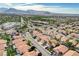 A neighborhood with tree-lined streets, well-maintained homes, and community amenities amid mountain views at 8416 Dry Cliff Cir, Las Vegas, NV 89128