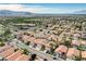Aerial view of a community featuring well-kept homes, mature trees, and access to nearby amenities at 8416 Dry Cliff Cir, Las Vegas, NV 89128