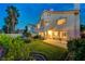 Lush backyard featuring green lawn, mature landscaping, a patio, and a charming view of the home at 8416 Dry Cliff Cir, Las Vegas, NV 89128