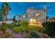 Well-manicured backyard with mature trees and landscaping, offering a serene and private outdoor space at 8416 Dry Cliff Cir, Las Vegas, NV 89128