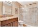 Bathroom featuring a glass shower, granite countertop, modern sink and matching cabinets at 8416 Dry Cliff Cir, Las Vegas, NV 89128