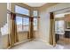 Bright bathroom features multiple windows, a soaking tub, a glass shower and tiled floors at 8416 Dry Cliff Cir, Las Vegas, NV 89128