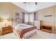 Cozy bedroom featuring a decorative iron bed frame and neutral color palette at 8416 Dry Cliff Cir, Las Vegas, NV 89128