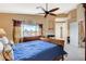 Spacious bedroom features large window, fireplace, walk-in closet and fan at 8416 Dry Cliff Cir, Las Vegas, NV 89128