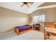 Bright bedroom with a single bed, a built-in desk, and a window allowing natural light at 8416 Dry Cliff Cir, Las Vegas, NV 89128
