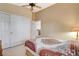 Bedroom featuring neutral colors, a ceiling fan, and closet with double doors at 8416 Dry Cliff Cir, Las Vegas, NV 89128