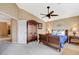 Main bedroom with carpet, bed, ceiling fan, and furnishings at 8416 Dry Cliff Cir, Las Vegas, NV 89128