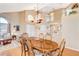 Spacious dining room featuring hardwood floors, modern lighting, and open floor plan at 8416 Dry Cliff Cir, Las Vegas, NV 89128