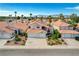 Charming two-story home featuring a terracotta roof, lush landscaping, and a two-car garage in a sunny neighborhood at 8416 Dry Cliff Cir, Las Vegas, NV 89128