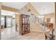 Inviting foyer with tile flooring, display cabinet, and staircase leading to the upper level at 8416 Dry Cliff Cir, Las Vegas, NV 89128