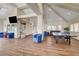 Bright community game room with a ping pong table, seating areas, and water views at 8416 Dry Cliff Cir, Las Vegas, NV 89128