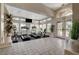 Well-lit gym with exercise equipment and floor to ceiling windows, providing a view of the outdoors at 8416 Dry Cliff Cir, Las Vegas, NV 89128