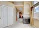 This hallway features ample closet space, a fireplace, and neutral decor at 8416 Dry Cliff Cir, Las Vegas, NV 89128