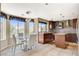 Gourmet kitchen with granite countertops, stainless steel appliances, and a breakfast nook at 8416 Dry Cliff Cir, Las Vegas, NV 89128