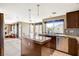 Bright kitchen featuring granite counters, a stainless steel dishwasher, and custom window treatments at 8416 Dry Cliff Cir, Las Vegas, NV 89128