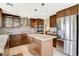 Modern kitchen boasts stainless steel appliances, granite counters, and center island at 8416 Dry Cliff Cir, Las Vegas, NV 89128