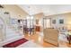 Bright living room featuring hardwood floors, staircase, and ample natural light at 8416 Dry Cliff Cir, Las Vegas, NV 89128