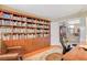 Spacious office features built in bookshelves, and hardwood flooring at 8416 Dry Cliff Cir, Las Vegas, NV 89128