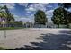 Outdoor sand volleyball court is ready for a friendly game, with lake views and nearby picnic areas at 8416 Dry Cliff Cir, Las Vegas, NV 89128