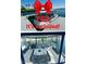 Boat at the end of the dock ready to explore the lake with a roomy interior and plenty of seating at 9 Rue Grimaldi Way, Henderson, NV 89011