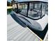 Beautiful boat at a dock on a lake with blue and grey accents and comfortable seating at 9 Rue Grimaldi Way, Henderson, NV 89011