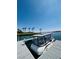 Covered boat on a private dock with clear blue sky and palm trees in the background at 9 Rue Grimaldi Way, Henderson, NV 89011