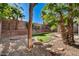 Landscaped backyard features stylish rock ground cover, mature trees, and a unique custom lawn area at 9021 Rendon St, Las Vegas, NV 89143