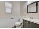 Updated bathroom features a vanity with a sink and a toilet at 9021 Rendon St, Las Vegas, NV 89143