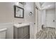 Updated bathroom features a vanity with a sink and storage cabinets at 9021 Rendon St, Las Vegas, NV 89143