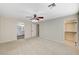 The bedroom boasts carpeted floors and archways to the bathroom and closet at 9021 Rendon St, Las Vegas, NV 89143