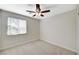 Bedroom featuring neutral walls and carpet, a ceiling fan and natural light from a window at 9021 Rendon St, Las Vegas, NV 89143