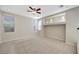 Bright, carpeted bedroom with recessed lighting, ceiling fan, and multiple windows for natural light at 9021 Rendon St, Las Vegas, NV 89143
