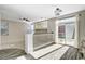 Open bonus room with light floors, a ceiling fan, and sliding glass doors at 9021 Rendon St, Las Vegas, NV 89143