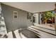 Covered patio with concrete flooring adjacent to home with sliding glass door entrance at 9021 Rendon St, Las Vegas, NV 89143