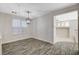 Inviting dining area with wood-look flooring, a stylish pendant light, and plenty of natural light at 9021 Rendon St, Las Vegas, NV 89143